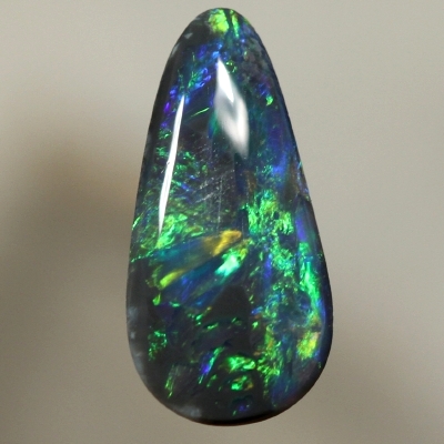SOLID BLACK OPAL Bright orange plays along side green over blue